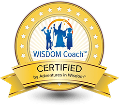 A gold colored badge with the words " wisdom coach " on it.